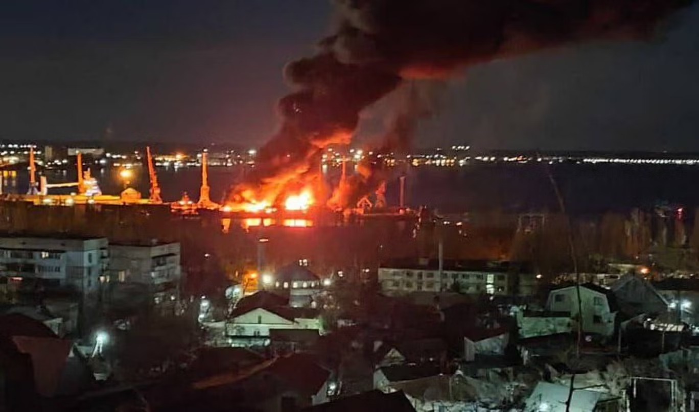 A Russian ship on fire after a drown strike by Ukrain
